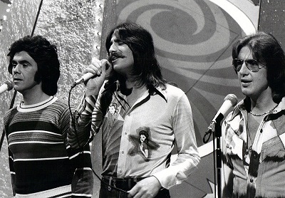Three Dog Night vocalists on a 1975 NBC TV show: Danny Hutton, Chuck Negron, and Cory Wells.