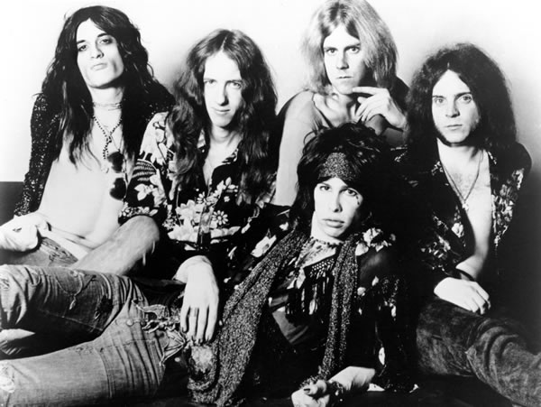 Raunchy boys in the '70s: Perry, Whitford, Tyler (reclining), Hamilton, and Kramer.