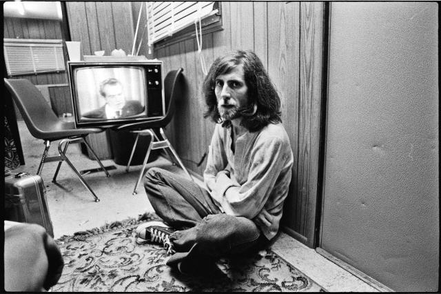 Backstage at Roosevelt Stadium on the 1974 tour, with Richard Nixon on the tube. Photo by Henry Diltz